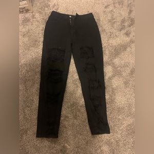 Straight legged jeans with holes